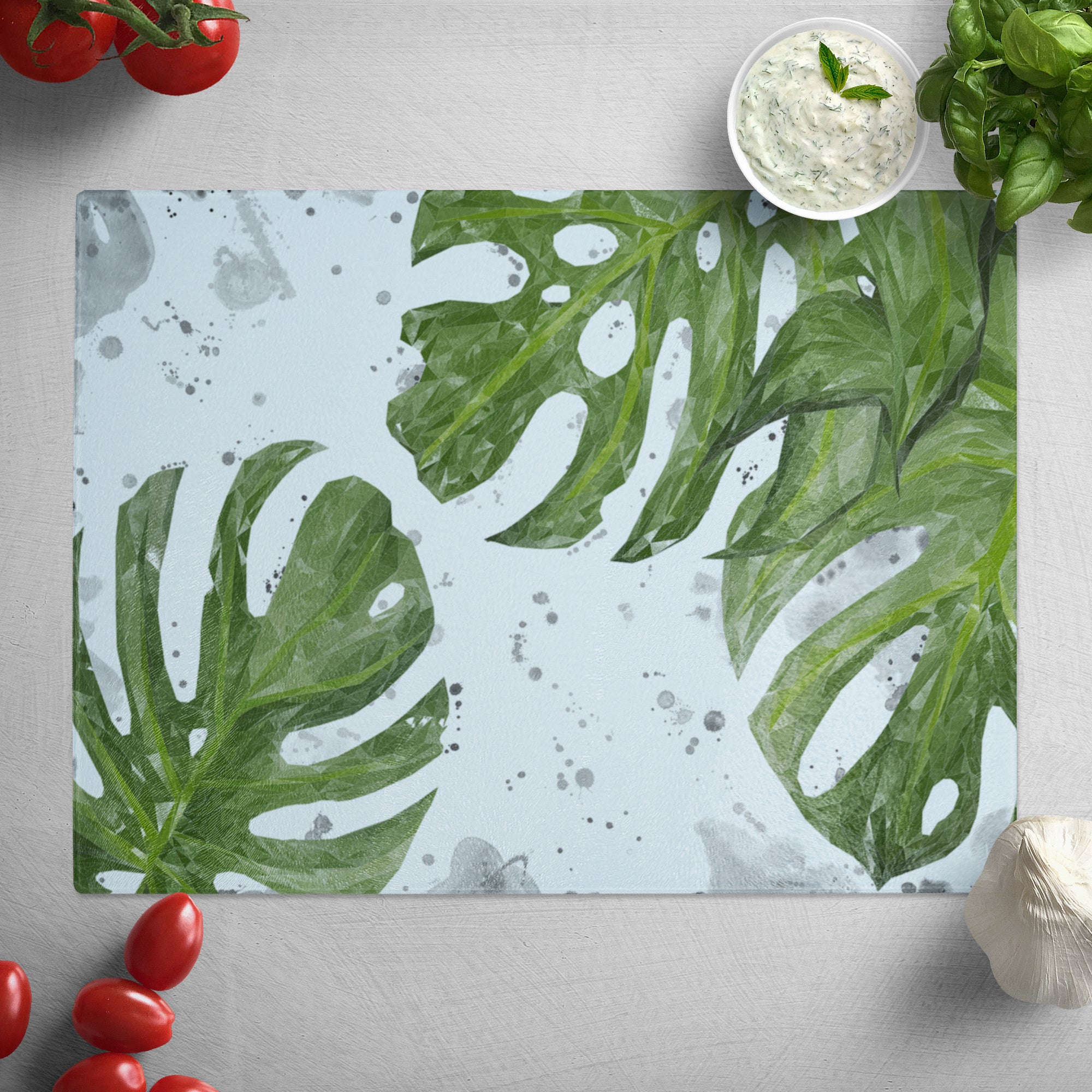 "Tranquillity" Monstera Plant (Grey Background Splashes) Glass Worktop Saver